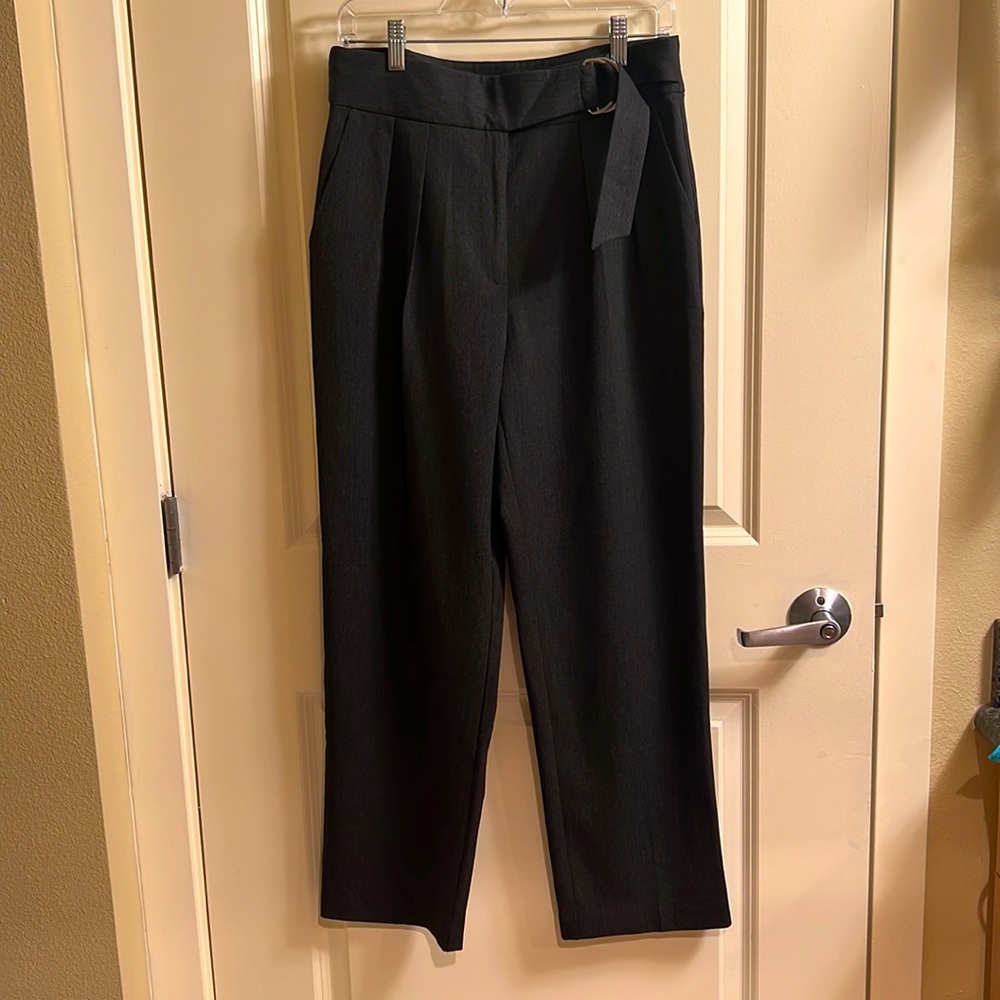 Dark grey wide leg trousers.